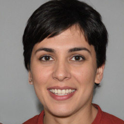 Joyful white young-adult female with medium  black hair and brown eyes