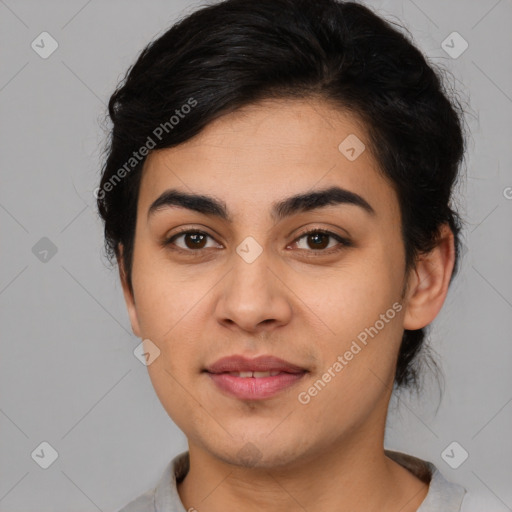 Joyful latino young-adult female with medium  brown hair and brown eyes