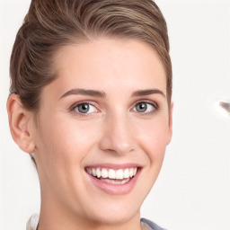 Joyful white young-adult female with long  brown hair and blue eyes