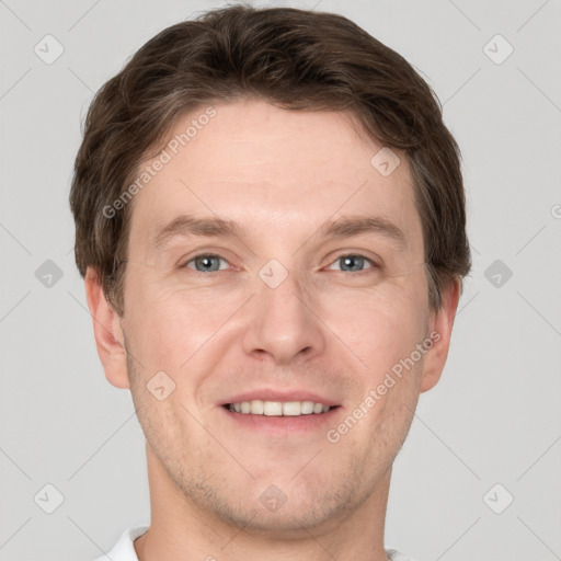 Joyful white adult male with short  brown hair and grey eyes