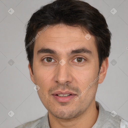 Joyful white adult male with short  brown hair and brown eyes