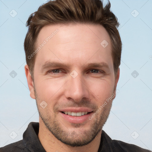 Joyful white adult male with short  brown hair and brown eyes