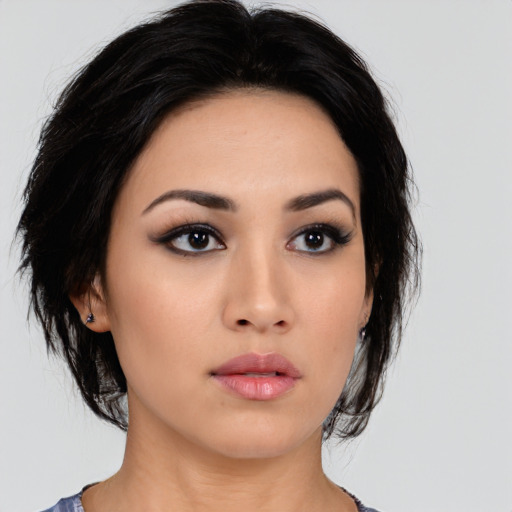 Neutral white young-adult female with medium  black hair and brown eyes