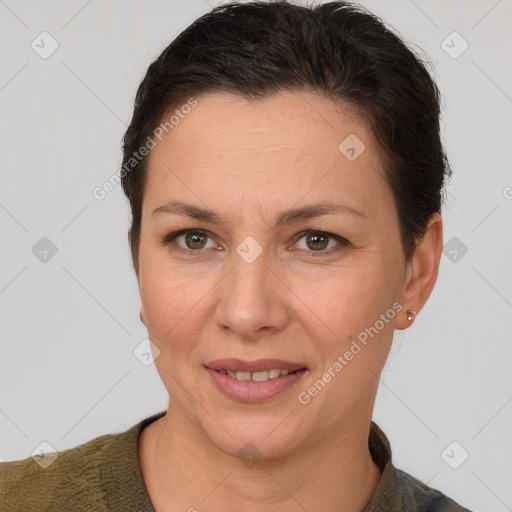 Joyful white adult female with short  brown hair and brown eyes