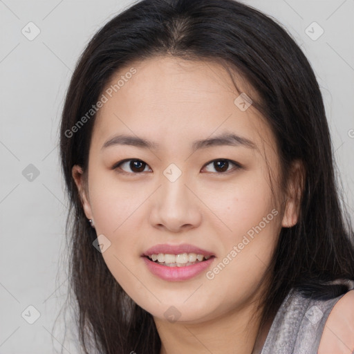 Joyful asian young-adult female with long  brown hair and brown eyes