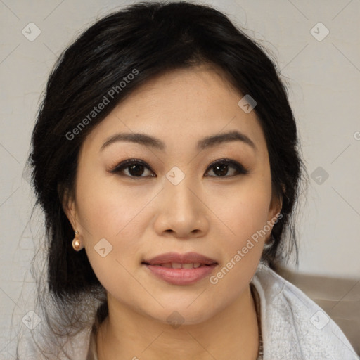 Joyful asian young-adult female with medium  black hair and brown eyes