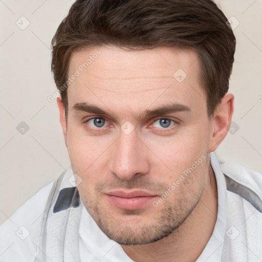 Neutral white young-adult male with short  brown hair and brown eyes