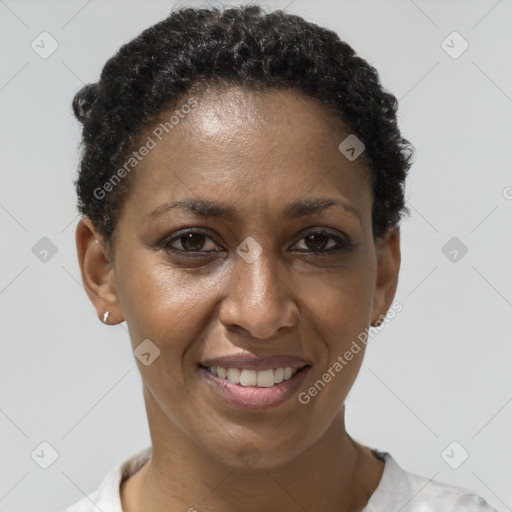 Joyful black adult female with short  brown hair and brown eyes