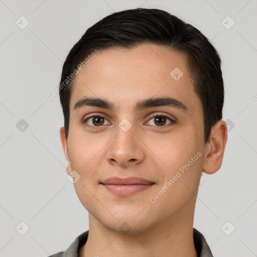 Joyful white young-adult male with short  brown hair and brown eyes