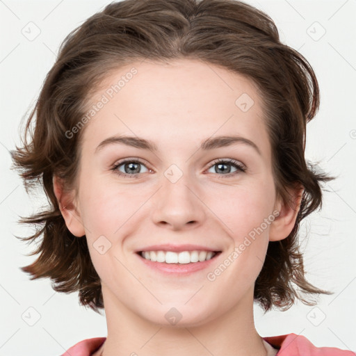 Joyful white young-adult female with medium  brown hair and blue eyes