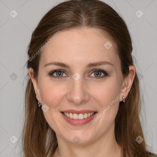 Joyful white young-adult female with long  brown hair and grey eyes