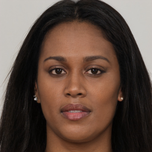 Joyful asian young-adult female with long  brown hair and brown eyes