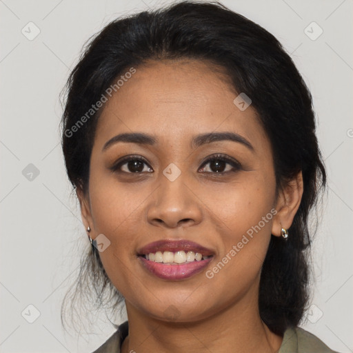 Joyful latino young-adult female with medium  black hair and brown eyes