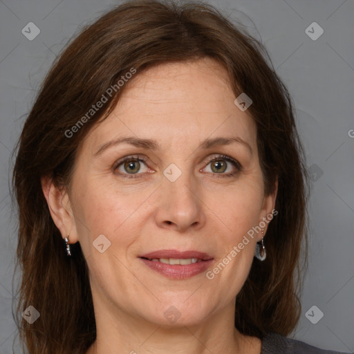 Joyful white adult female with medium  brown hair and grey eyes