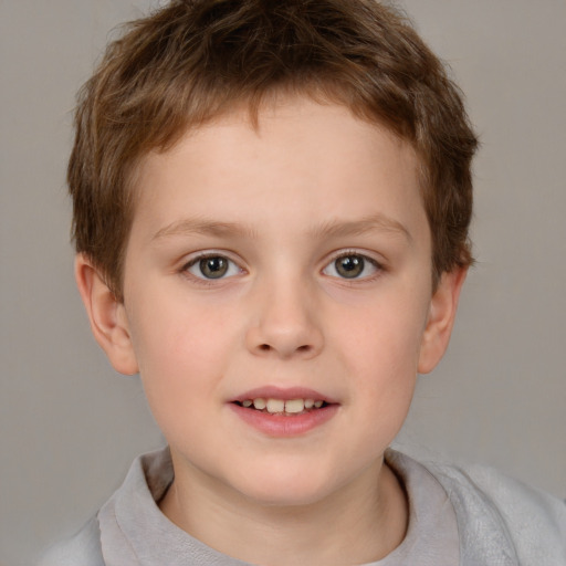 Joyful white child male with short  brown hair and brown eyes