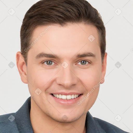 Joyful white young-adult male with short  brown hair and grey eyes