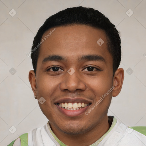 Joyful latino young-adult male with short  black hair and brown eyes