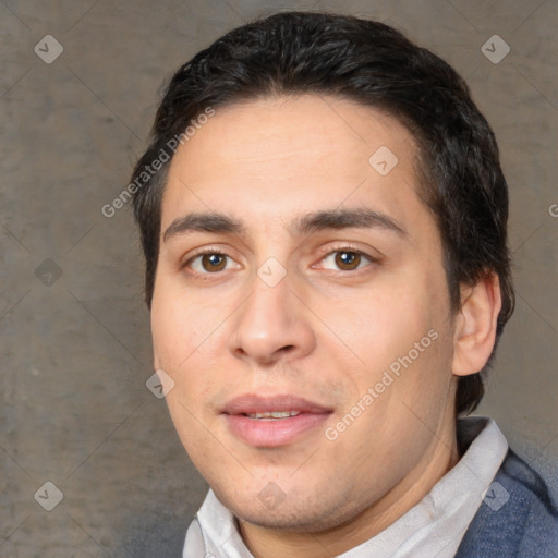 Joyful white young-adult male with short  black hair and brown eyes