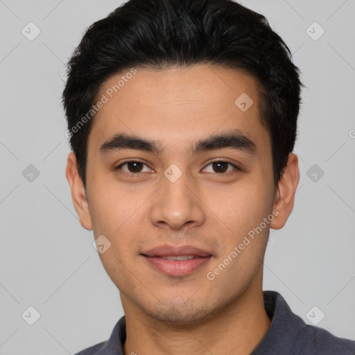 Joyful white young-adult male with short  black hair and brown eyes