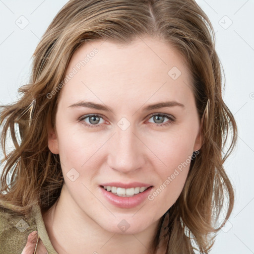 Joyful white young-adult female with long  brown hair and blue eyes