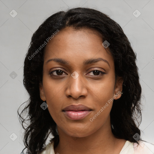 Joyful black young-adult female with long  black hair and brown eyes