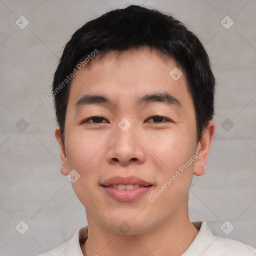 Joyful asian young-adult male with short  black hair and brown eyes