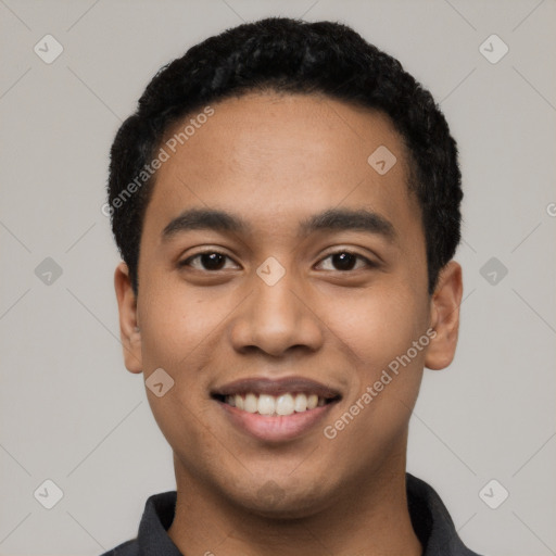 Joyful latino young-adult male with short  black hair and brown eyes