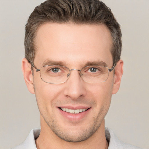 Joyful white adult male with short  brown hair and brown eyes