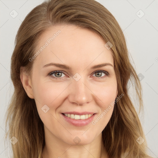 Joyful white young-adult female with long  brown hair and blue eyes