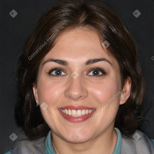 Joyful white young-adult female with medium  brown hair and blue eyes