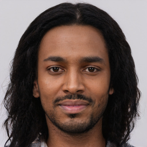 Neutral black young-adult male with long  black hair and brown eyes
