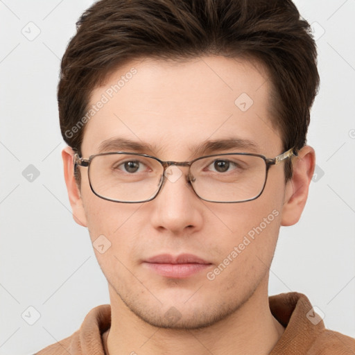 Neutral white young-adult male with short  brown hair and brown eyes