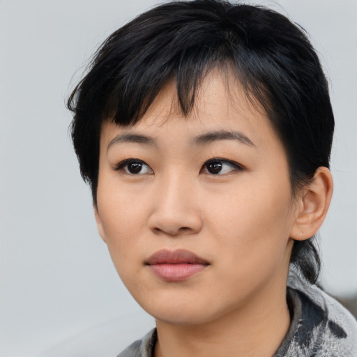 Neutral asian young-adult female with medium  black hair and brown eyes