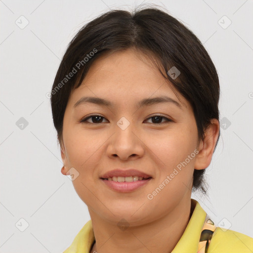 Joyful asian young-adult female with short  brown hair and brown eyes