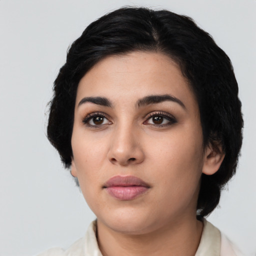 Neutral latino young-adult female with medium  black hair and brown eyes