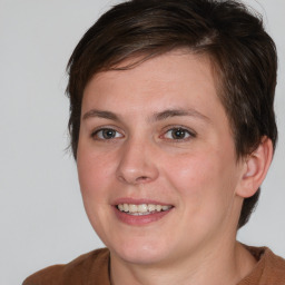 Joyful white young-adult female with medium  brown hair and brown eyes