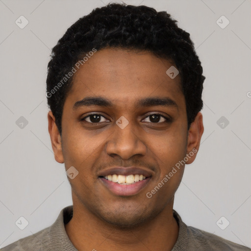 Joyful black young-adult male with short  black hair and brown eyes