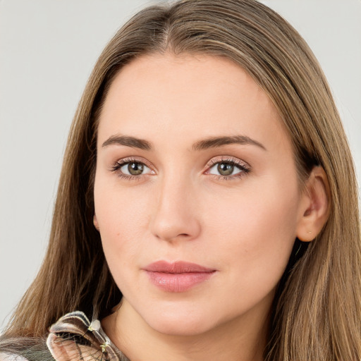 Neutral white young-adult female with long  brown hair and green eyes