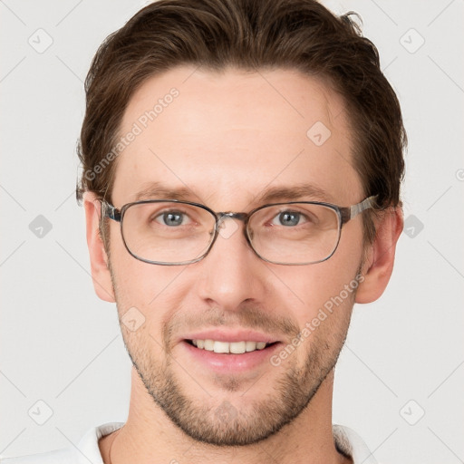 Joyful white adult male with short  brown hair and grey eyes