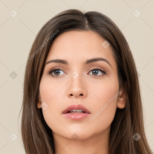 Neutral white young-adult female with long  brown hair and brown eyes