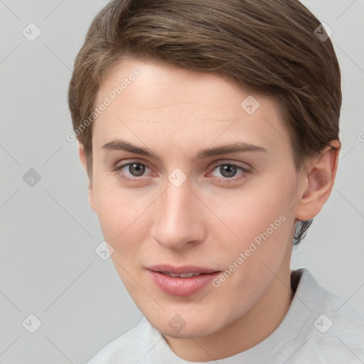 Joyful white young-adult female with short  brown hair and grey eyes