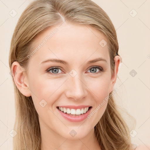 Joyful white young-adult female with long  brown hair and blue eyes