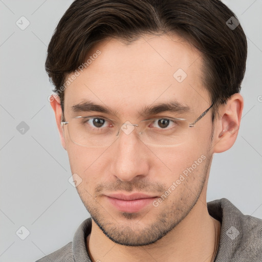 Joyful white young-adult male with short  brown hair and brown eyes