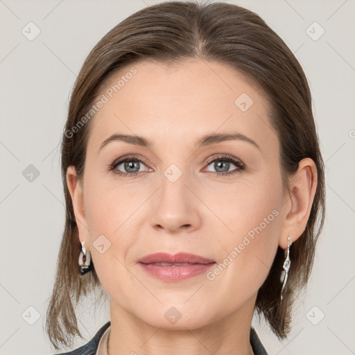 Joyful white young-adult female with medium  brown hair and grey eyes