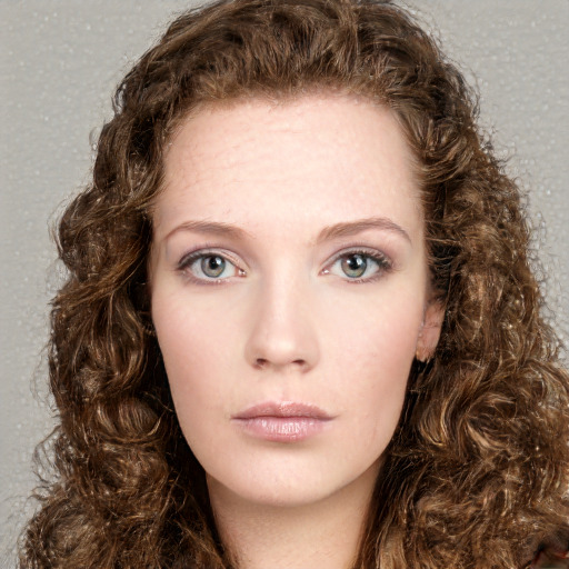 Neutral white young-adult female with long  brown hair and green eyes