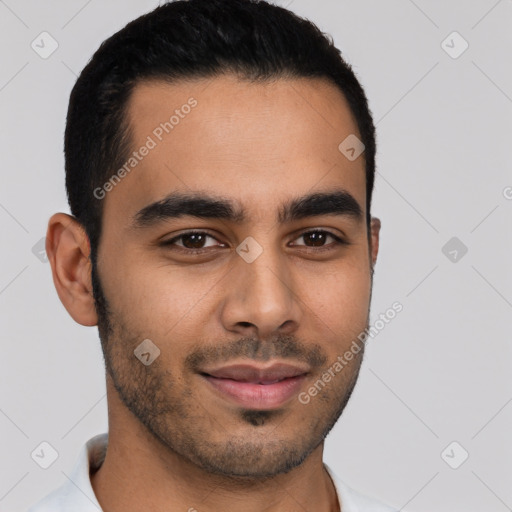 Joyful latino young-adult male with short  brown hair and brown eyes