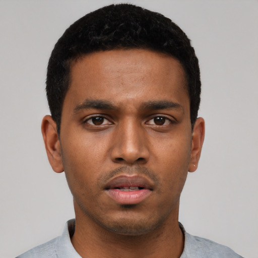 Neutral black young-adult male with short  black hair and brown eyes