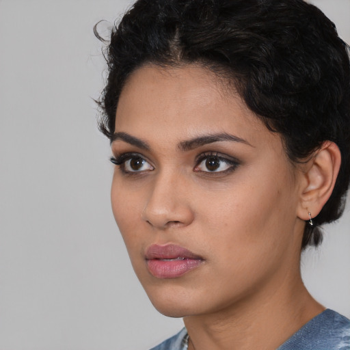 Neutral latino young-adult female with short  black hair and brown eyes