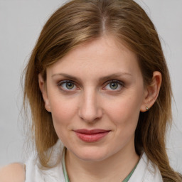 Joyful white young-adult female with medium  brown hair and blue eyes