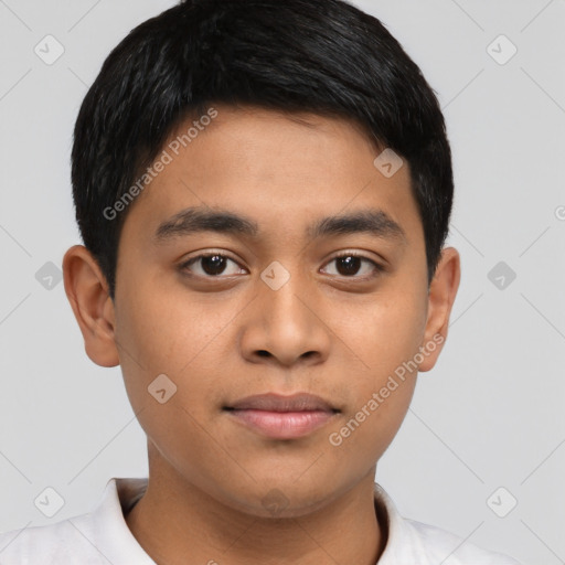 Joyful latino young-adult male with short  brown hair and brown eyes